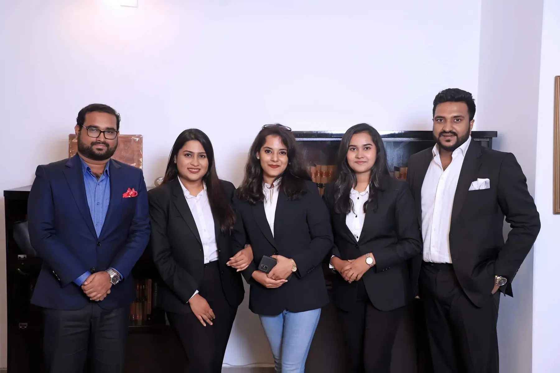 Cyrus with a team of business professionals